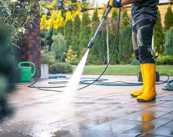 Professional pressure washing a paved patio in Plettenberg Bay